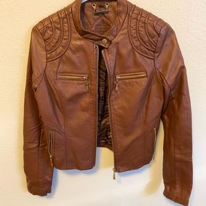 Brown leather jacket with gold hardware